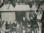 Bridgewater College, Photograph of a basketball game in the Old Gym, featuring Billy Burkholder with ball, 1951 by Bridgewater College