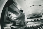 Bridgewater College, Fish-eye lens photograph of Dr. John Barr playing the organ, undated by Bridgewater College