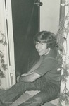 Bridgewater College, Photograph of Mark Bowser decorating a door for Christmas, 1970s by Bridgewater College