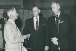 Bridgewater College, Photograph of Board of Trustees chairman I. C. Senger presenting the new gymnasium key to President Warren D. Bowman, 6 Feb 1958 by Bridgewater College