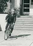 Bridgewater College, Photograph of Professor William E. Barnett on a bicycle, 1972 by Bridgewater College
