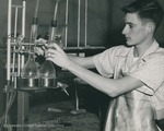 Bridgewater College, Photograph of Dave Bowman setting up a chemistry experiment, undated by Bridgewater College