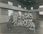 Bridgewater College, Coach Daniel S. Geiser meeting on the court with the men's junior varsity basketall team, circa 1949 by Bridgewater College