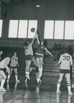 Bridgewater College Women's basketball action photograph featuring Mari L. Moore (21), circa 1974 by Bridgewater College