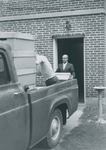 Bridgewater College, Librarian Orland Wages preparing to load a box of books on the truck from Cole Hall to the new Alexander Mack Memorial Library, 18 Sept 1963