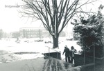 Bridgewater College, Students climbing steps in snow with Bowman Hall in far distance, undated by Bridgewater College