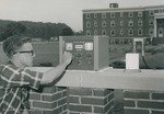 Bridgewater College, Photograph of Leroy Carter using a Tracer Lab Uitilty Scaler, undated by Bridgewater College
