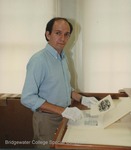Bridgewater College, Photograph of David Cook working with the Isaac J. Sanger art collection, July 1990 by Bridgewater College
