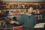 Bridgewater College, Photograph of Producer Tim Warren for Personal FX: The Collectibles Show with Professor David Cook's Zorro collection, 26 March 1996 by Bridgewater College
