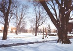Bridgewater College. Campus in snow with student walking toward Kline Campus Center, circa 1976 by Bridgewater College