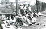 Bridgewater College, Students watching an event in field, circa 1980 by Bridgewater College