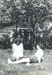 Bridgewater College, Chris Constable and Matt Smith sitting in grass by Wakeman Hall, May 1986 by Bridgewater College