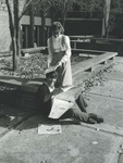 Bridgewater College, Bobbi Simmers and Duane Dinkel looking at newspapers outside the Kline Campus Center, November 1985 by Bridgewater College