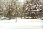 Bridgewater College, Student in red hoodie crossing campus in snow, 14 Nov 1995 by Bridgewater College