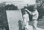 Bridgewater College, A class of 1973 woman fitted with a beanie by the beanies for sale sign, 1969 by Bridgewater College