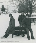 Bridgewater College, Men from the Class of 1977 joke around the Heritage Hall sign in the snow, circa 1974 by Bridgewater College
