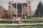 Bridgewater College, Student resting on bench outside Cole Hall, 1991 by Bridgewater College