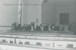 Choir trying on robes in College Street Church-Bridgewater Church of the Brethren, circa 1985 by Bridgewater College