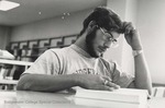 Bridgewater College, Bob Anderson (photographer), Photograph of Chuck DeCesari studying in the library, 1970s by Bob Anderson