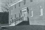 Bridgewater College, Woman carrying things up steps of Dillon Hall, December 1969 by Bridgewater College