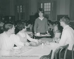 Bridgewater College, Student joins a table in the Rebecca Hall dining room, circa 1966 by Bridgewater College