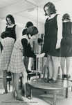 Bridgewater College, A student pinning the jumper hem of another student, Dec 1969