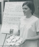 Bridgewater College, A student holding a star-shaped dessert in front of a recipe for a gelatin mold, undated by Bridgewater College