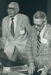 Bridgewater College, Walter S. Flory and Guy E. Wampler registering for the charter meeting of the Fifty-Year Club, 1983 by Bridgewater College