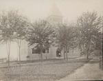 Bridgewater College, A man stands in the entry of Founders' Hall, circa 1905 by Bridgewater College