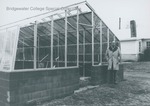 Bridgewater College, Biology professor L Michael Hill by BC greenhouse, 1988 by Bridgewater College