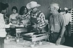 Bridgewater College, Photograph of William E. Barnett, Lowell Heisey and others serving food, 1982 by Bridgewater College