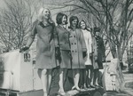 Bridgewater College, Six female students standing on construction equipment at Homecoming, circa 1967