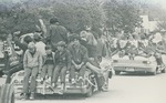 Bridgewater College, Boys, cheerleaders and other college students riding on cars in the Homecoming parade, 1971