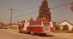 Bridgewater College, Cheerleaders riding on a fire engine at Homecoming, probably 1973