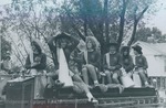Bridgewater College, Cheerleaders wearing cowgirl hats and riding on a firetruck at Homecoming, 4 Oct 1980