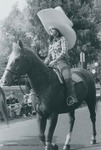 Bridgewater College, A student riding a horse and wearing an oversized cowgirl hat in the Homecoming parade, 1981 by Bridgewater College