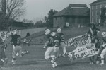 Bridgewater College, Football players rushing the field at Homecoming, 1981 by Bridgewater College