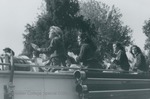 Bridgewater College, Cheerleaders riding on a firetruck in the Homecoming Parade, 1981