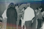 Bridgewater College, People looking at scrapbooks at Homecoming, 1984