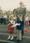 Bridgewater College, President Geisert and child Homecoming Queen attendants at Homecoming, 1985 by Bridgewater College