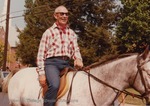 Bridgewater College, Professor William Barnett riding a horse in the Homecoming parade, undated by Bridgewater College
