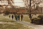 Bridgewater College, Students walk in a light snow up a walkway with the Kline Campus Center behind them, January 1985 by Bridgewater College