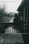 Bridgewater College, Denise Taylor (photographer), student walking from Cole Hall to the Alexander Mack Memorial Library in the rain, view from Cole Hall balcony with Kline Campus Center at right, undated by Denise Taylor
