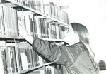 Bridgewater College, Denise Taylor (photographer), student in stacks at Alexander Mack Memorial Library, late 1970s by Denise Taylor