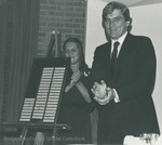 Bridgewater College, Student Senate President Cathy Slusher and Senator John W. Warner with the Obenshain Scholarship Fund patrons plaque, 9 May 1980 by Bridgewater College