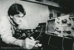 Bridgewater College, Photograph of a man using Physics equipment, undated by Bridgewater College
