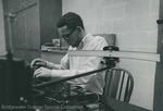 Bridgewater College, Photograph of a student using Physics equipment, undated by Bridgewater College