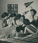 Bridgewater College, Female students eating snacks on a bed in a residence hall room, circa 1951 by Bridgewater College