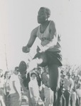Bridgewater College, Photograph of Alfred Whitelow jumping at a track meet, circa 1960 by Bridgewater College