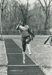 Bridgewater College, Photograph of Gerald Benjamin landing a long jump, circa 1981 by Bridgewater College